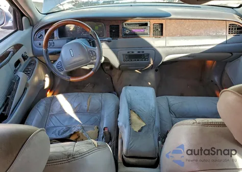 2002 Lincoln Town Car Signature z USA, uszkodzony, nr VIN 1LNHM82W52Y663488